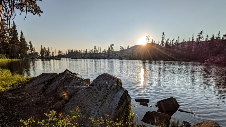 Sunset over the granite and evergreen landscape around one of the Loch Leven Lakes, Tahoe National Forest, CA.