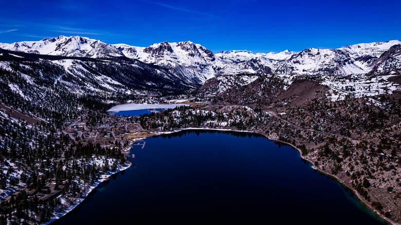 June Lake in California seen from above framed by snowy peaks