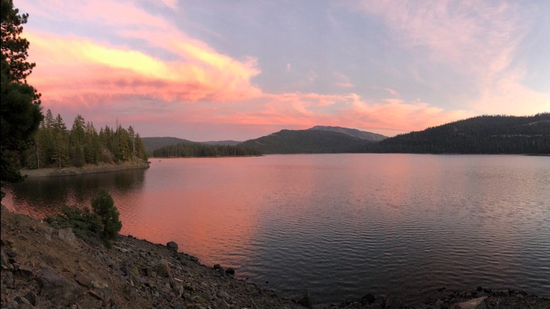 A pink and orange sunset across Jackson Meadow Reservoir