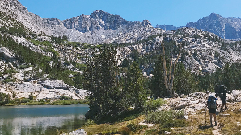 Backpackers hiking to Treasure Lakes in California