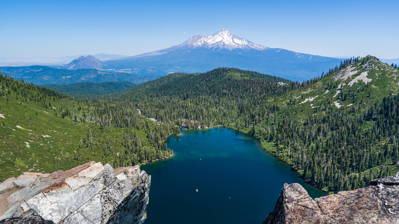 An aerial view of Castle Lake with Mount Shasta in the background