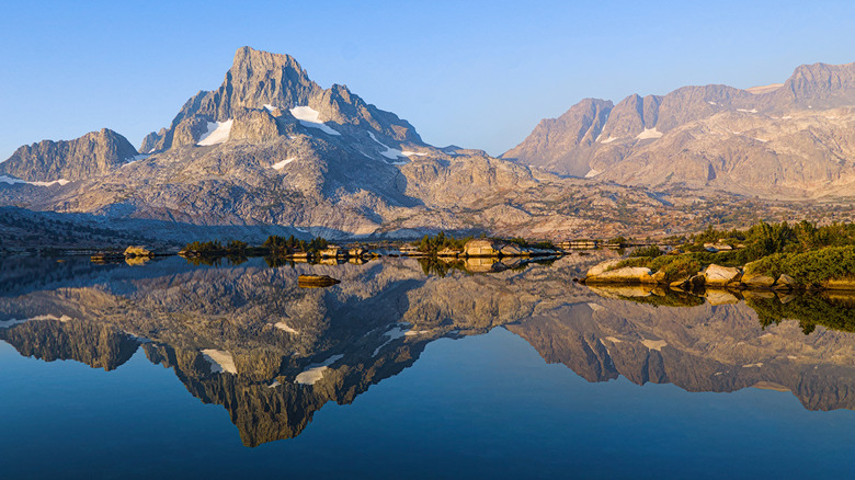 Stunning mountain reflections in the still water of Thousand Island Lake in California