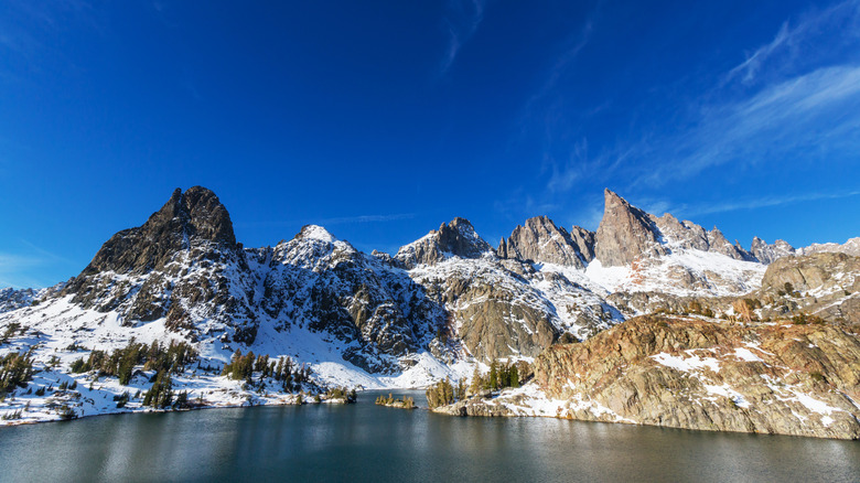 Jagged mountains surround the water of Minaret Lake, California