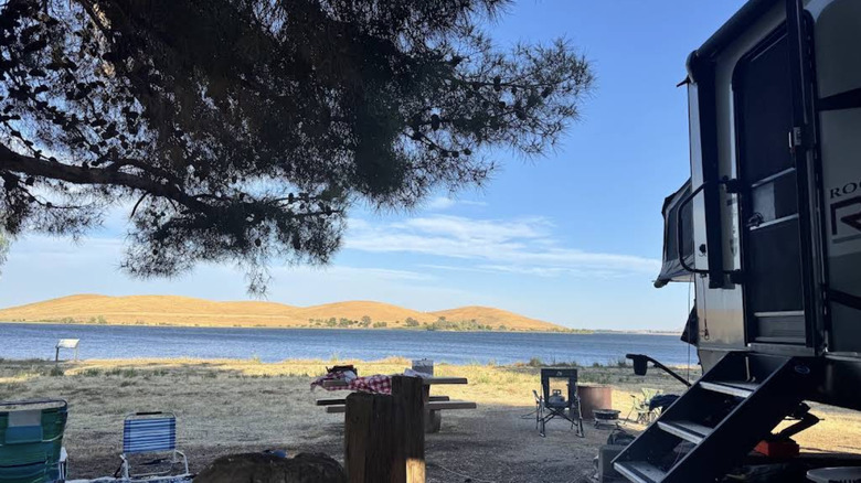 Trailer on a campsite at San Luis Creek campground with views of the water