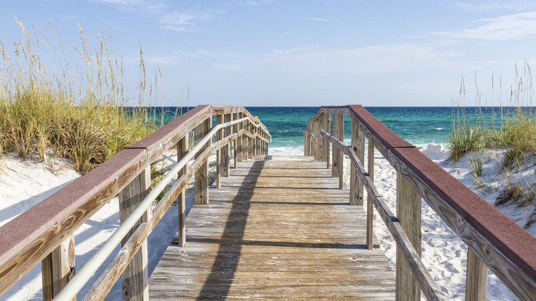 Wooden walkway and sand dunes in Pensacola Beach, Florida.