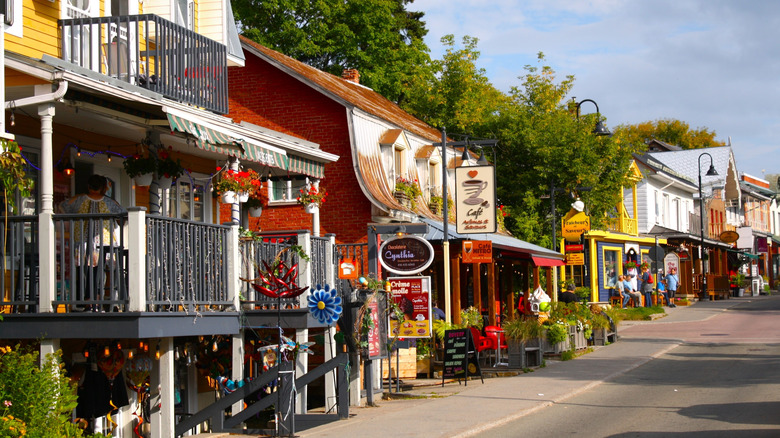 Street lined with shops and cafes in Baie-Saint-Paul, Quebec