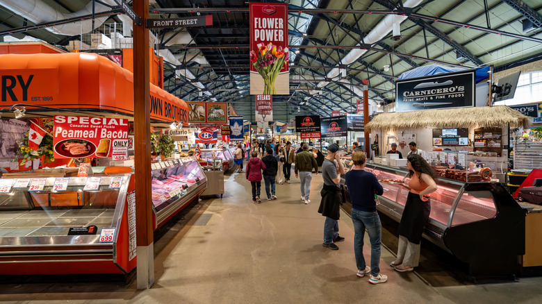 Food stalls frequented by people in St Lawrence Market