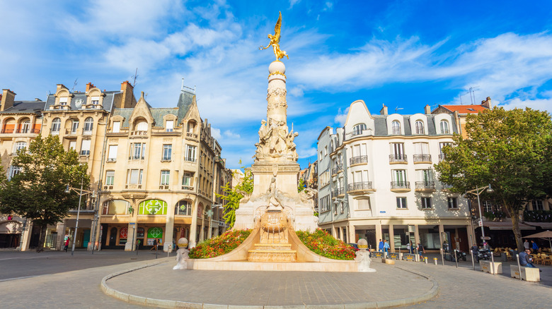 Fountain monument on a street in Reims, France