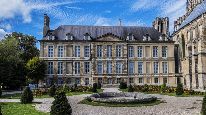 Front of the stately Palais du Tau in Reims, France