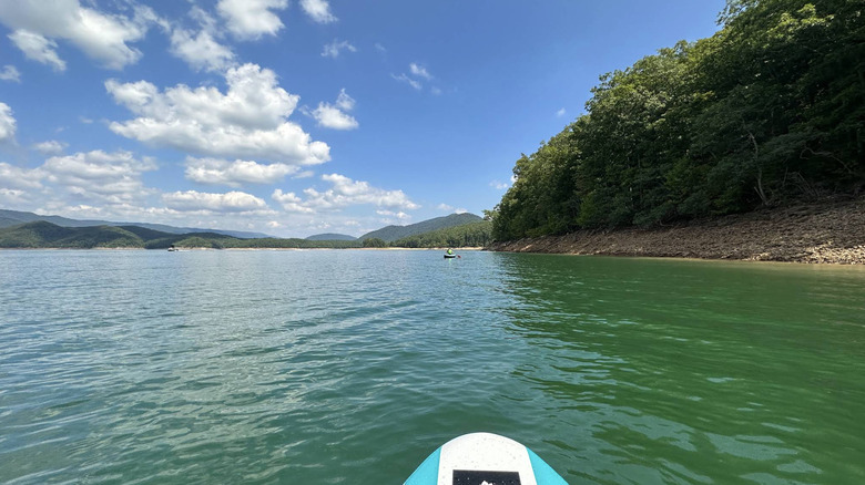 A paddleboard and kayak in Lake Moomaw