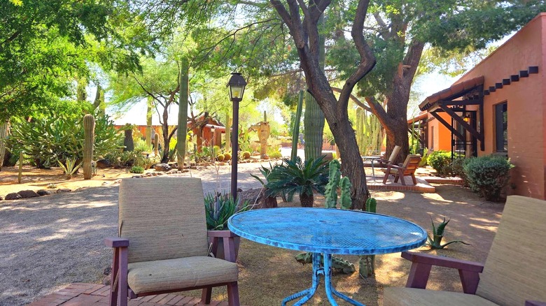 The gravel path and shaded patios behind the White Stallion Ranch's guest rooms in Tucson Arizona