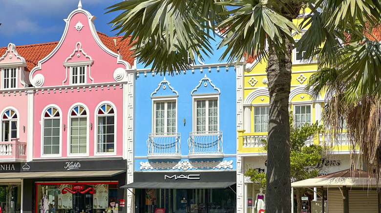 Colorful shops line the street in Aruba