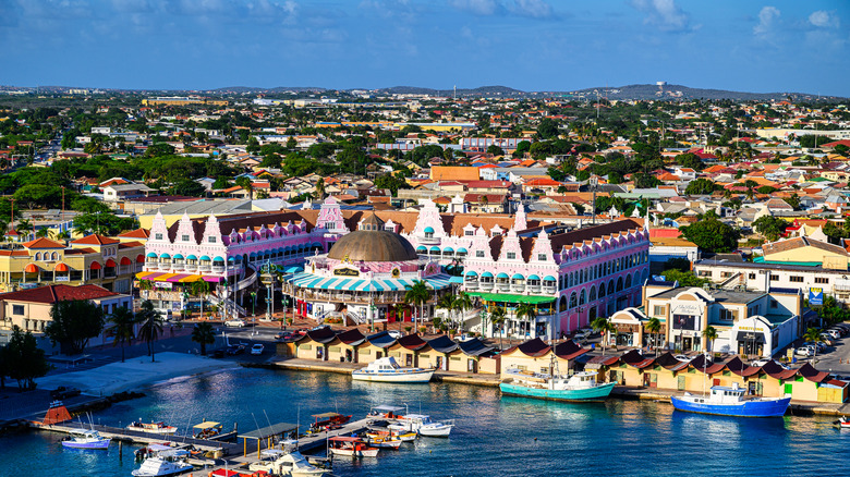 A drone view from the water onto the colorful city Oranjestad in Aruba