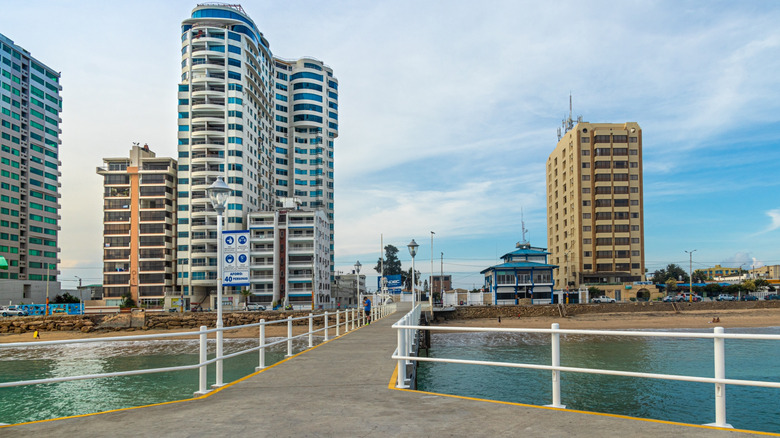High-rise buildings in front of sandy beach, concrete promenade in foreground, Salinas