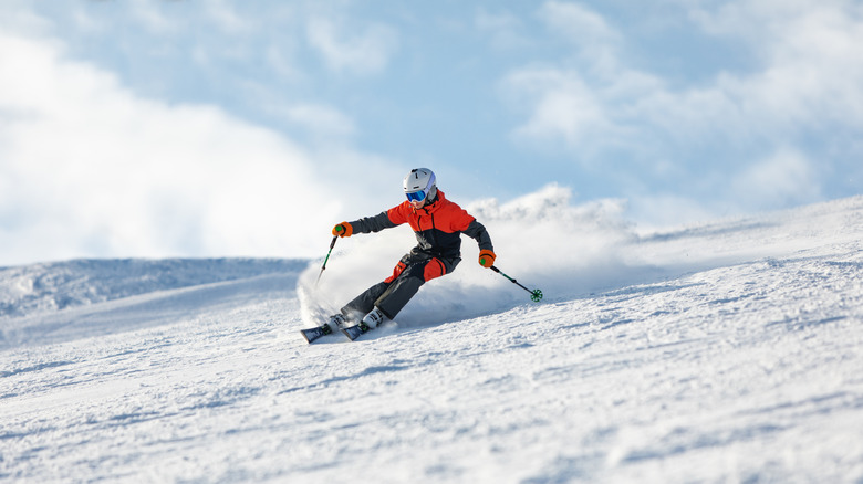 Teenage boy skiing down a mountain