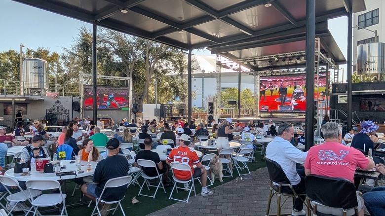 Ferg's covered outdoor patio with large TV screens