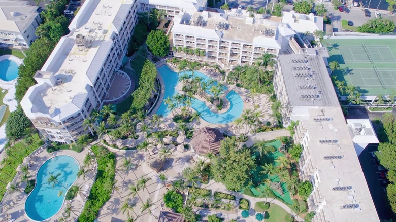 Sprawling beach resort with pools, tennis courts, and private beach area.