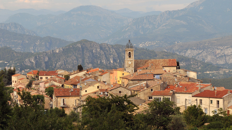 Distant view of the stone-built village of Bouyon and mountains in France