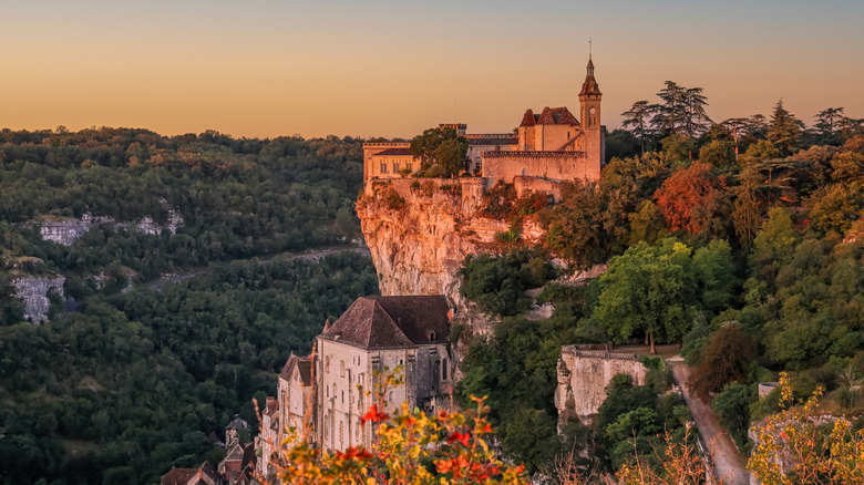 Chapels of Rocamadour, France in a cliffside during sunrise