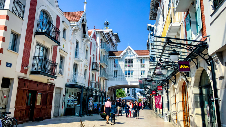 Tourists walking through the town center of Arcachon, France