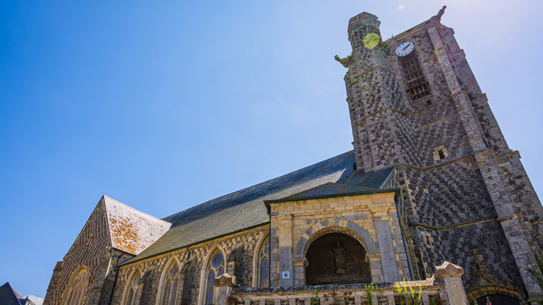 St. Peter Catholic Church of Ault with medieval checkerboard stonework exterior, Ault, France