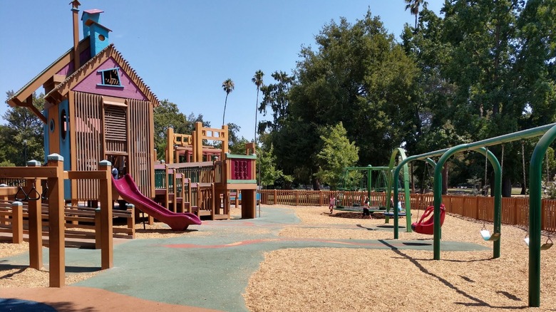An elaborate playground with slides, swings, and climbing equipment at McKinley Park in Sacramento.