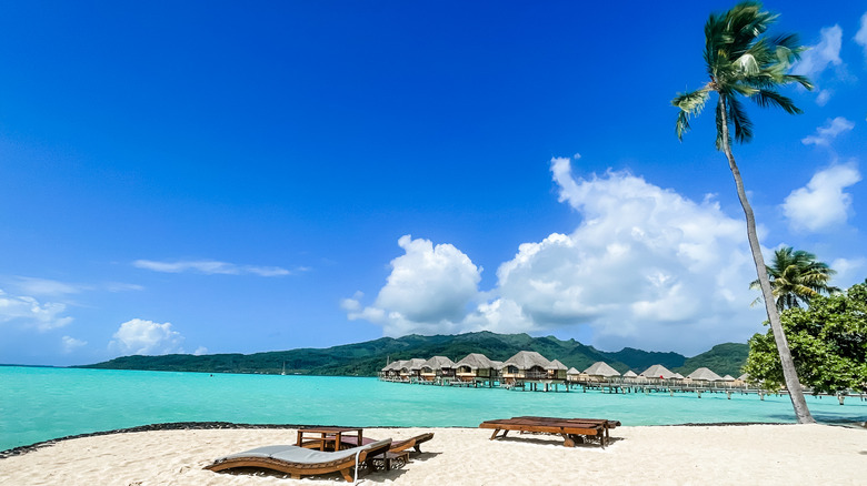 turquoise waters and overwater bungalow in Taha'a, French Polynesia