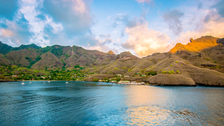 Sunset behind a village on the island of Nuku Hiva