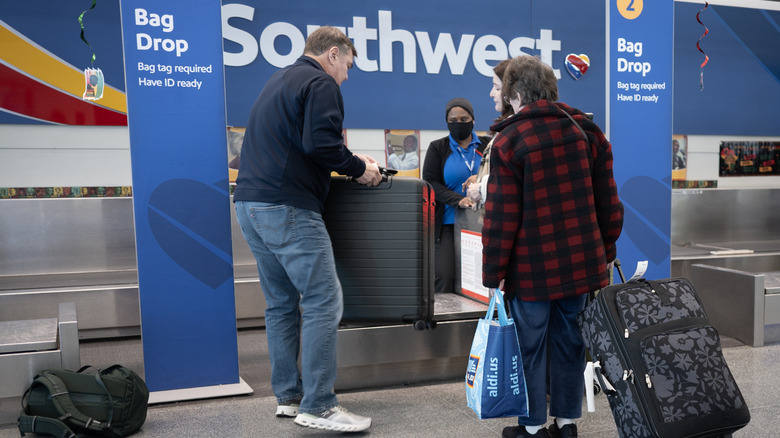 Passengers dropping off bags for Southwest Airlines