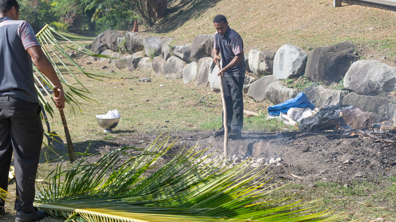 Fijian tending a lovo