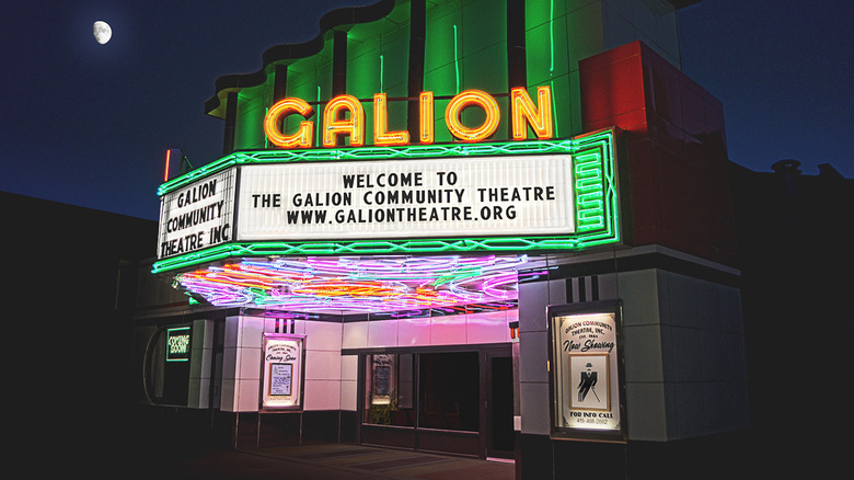 The well-lit and classic neon marquee of the Galion Theatre at night in downtown