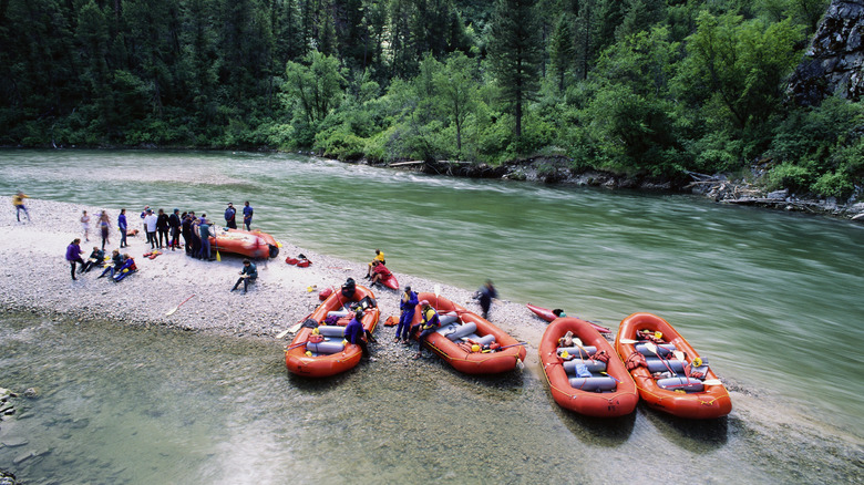 Group of river rafters stop for lunch on a sandbar on the Payette River, Idaho