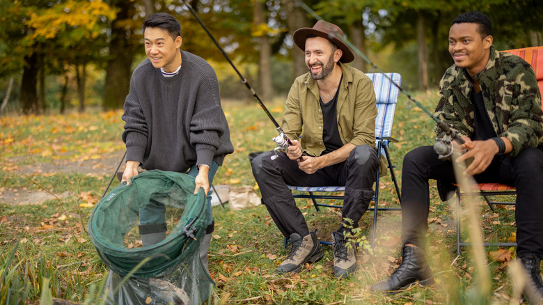 Young men fishing together