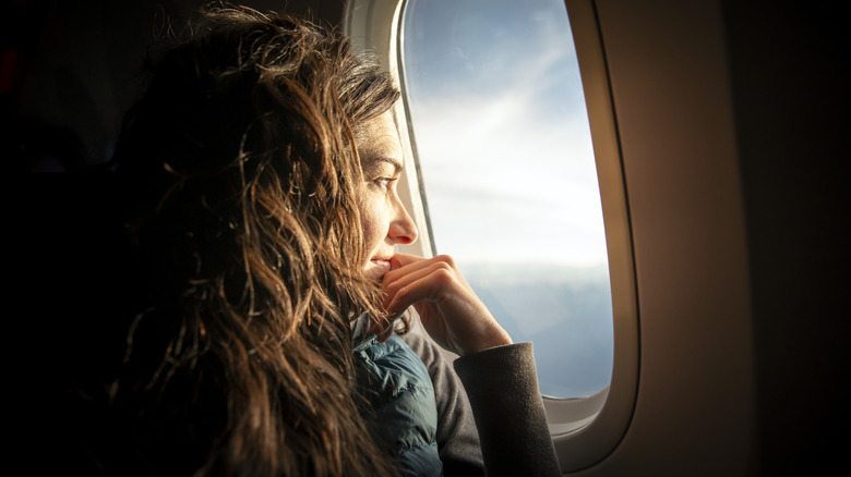 Woman in window seat