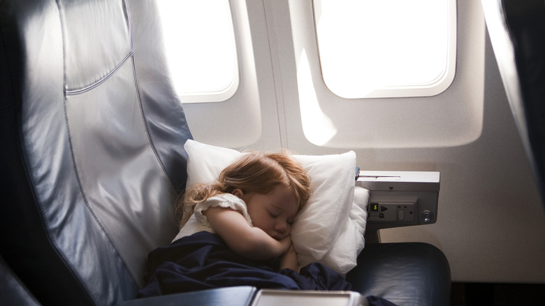 Girl sleeping on plane