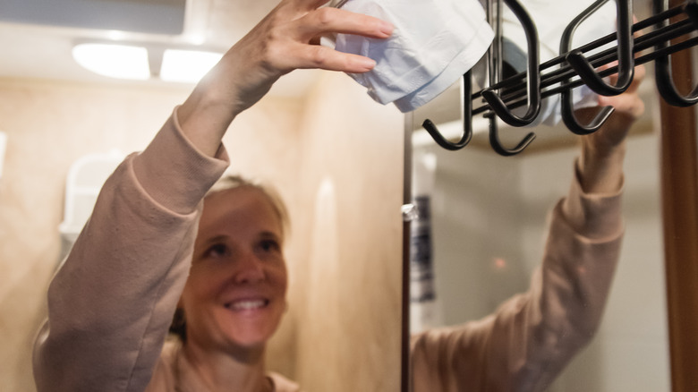 Woman installs toilet paper