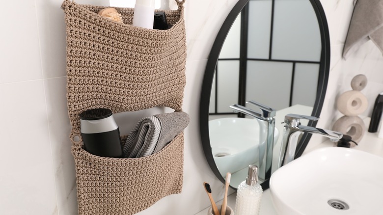 Fabric storage holder on bathroom wall