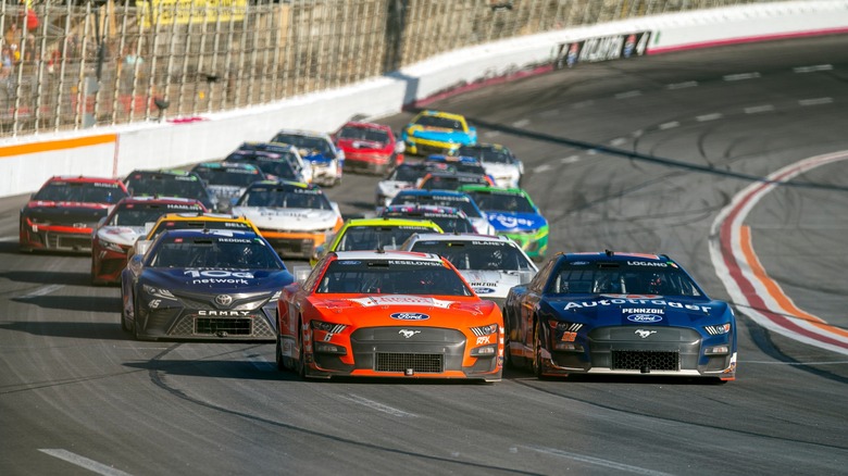 NASCAR cars racing on a track in Hampton, Georgia