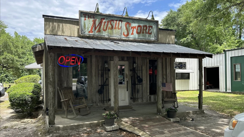 Small wooden building that reads The Music Store.