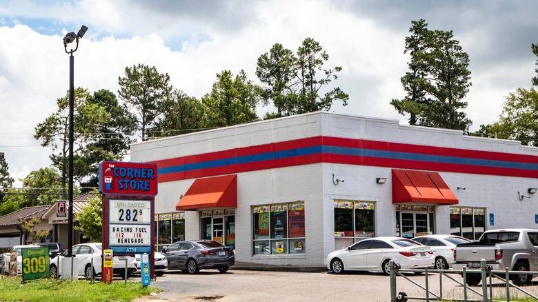 Exterior of a vintage corner store with cars parked in front in Waynesboro