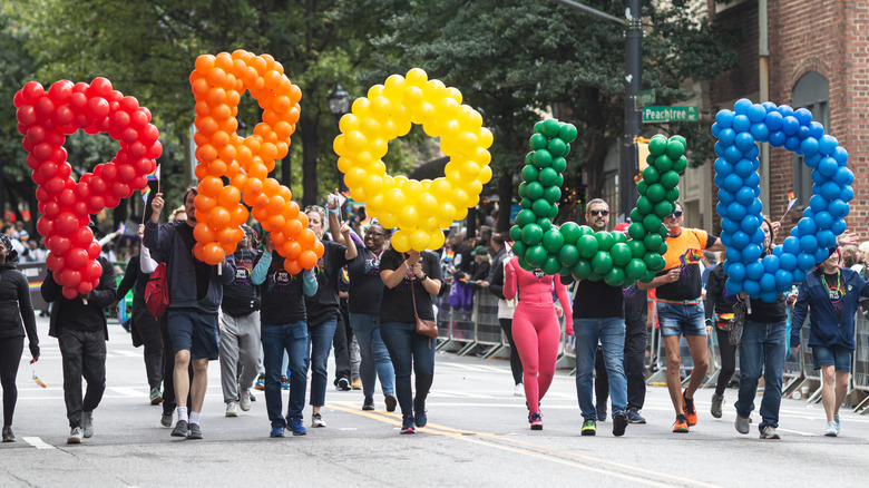 People attending a Pride parade in downtown Atlanta