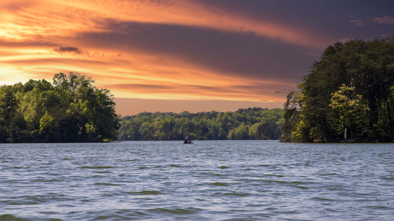 Boat with fishermen on Lake Lanier at sunset