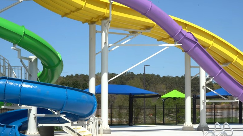 Water slides with cabanas in the background at Henry County's Aquatic Center