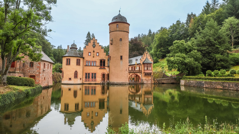 Mespelbrunn Castle surrounded by water and greenery