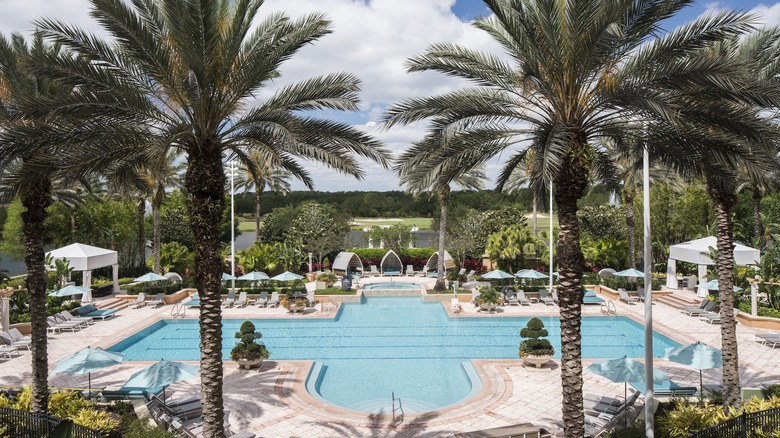 Woman in a cabana at the spa pool at The Ritz-Carlton Spa, Orlando, Grande Lakes