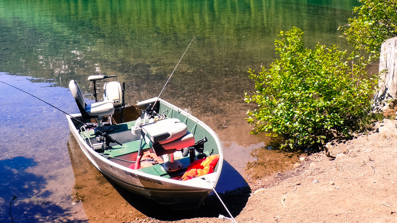 A fishing boat with a rod on the shores of Walupt Lake, Washington
