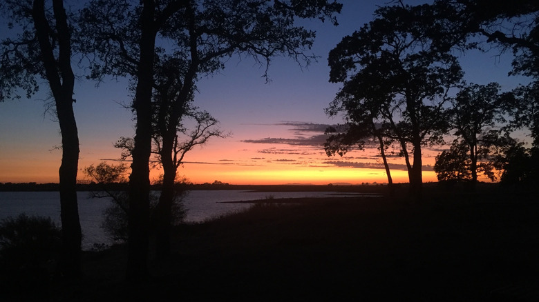 This is a photo from Camp Far West Lake during sunset which has camping options.