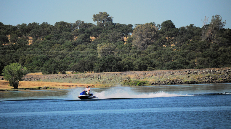 A jet skier out on Camp Far West Lake in California enjoying the lake