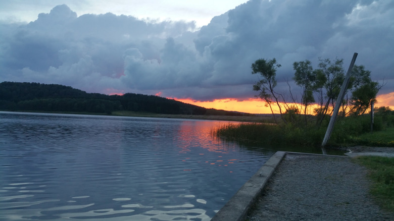 Pennsylvania's Beechwood Lake at sunset, with a gravel boat ramp
