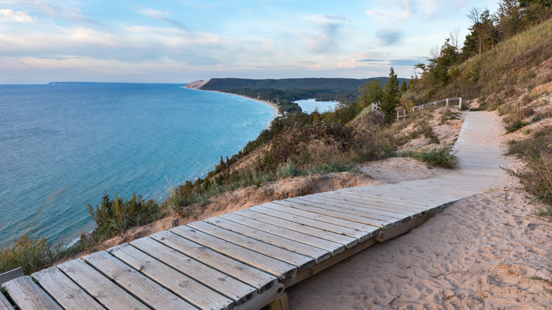 A weathered wooden walkway on the Empire Bluffs Trail near Lake Michigan, the Sleeping Bear Dunes, and North and South Bar lakes